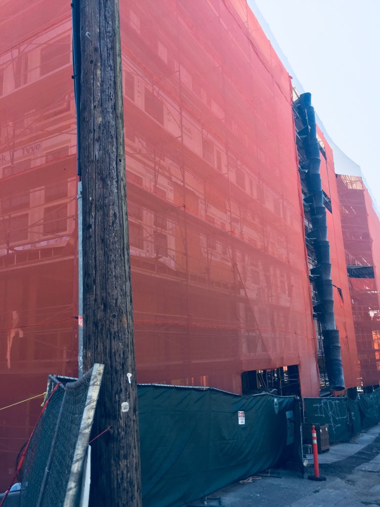 Premier Scaffold, Inc. building with a red tarp in front of it.