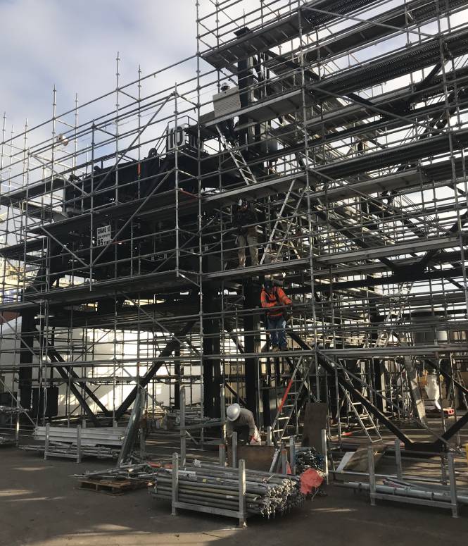 A large structure with Premier Scaffold in the background.